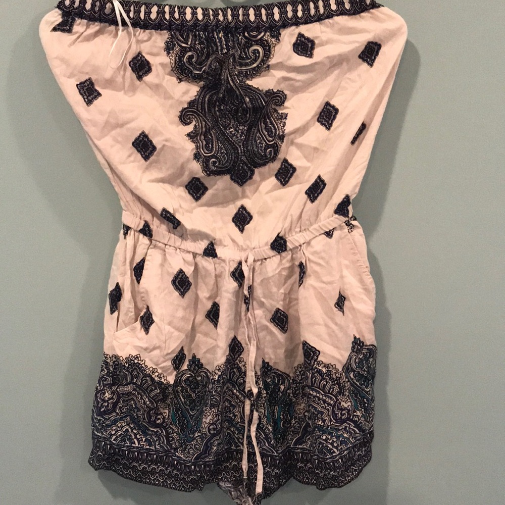 Strapless romper with adjustable waistband strings